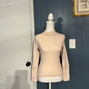 Free people 93% cotton 7% elastane moon cake is the color (light beige pink)